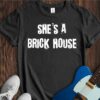 She's A Brick House Unisex Cotton Tee